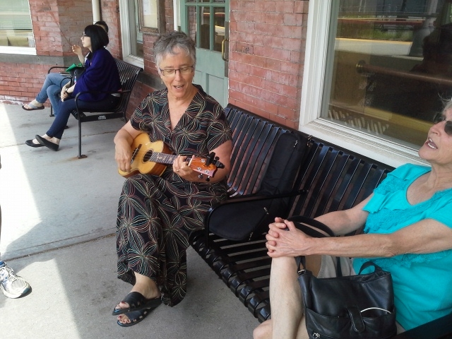 Seen at the LIRR Garden City station - Melva Fager and Barbara Stone, Jo Edwards, Helen Karel et. al.
Q: what is the correct caption for this photo ?
a)I just learned this  Wheels on the Train go round and round

b)I hope the choo choo comes along soo